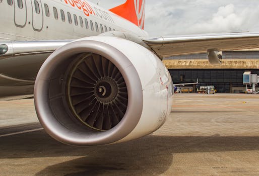 Detailed view of an aircraft engine on a runway in Belo Horizonte, Brazil, showcasing aviation technology.
