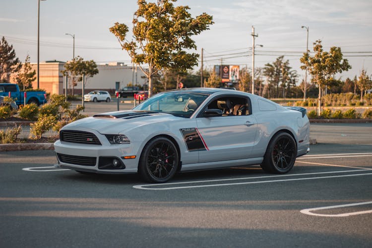 Sport Coupe Car On Parking Lot In Sunlight