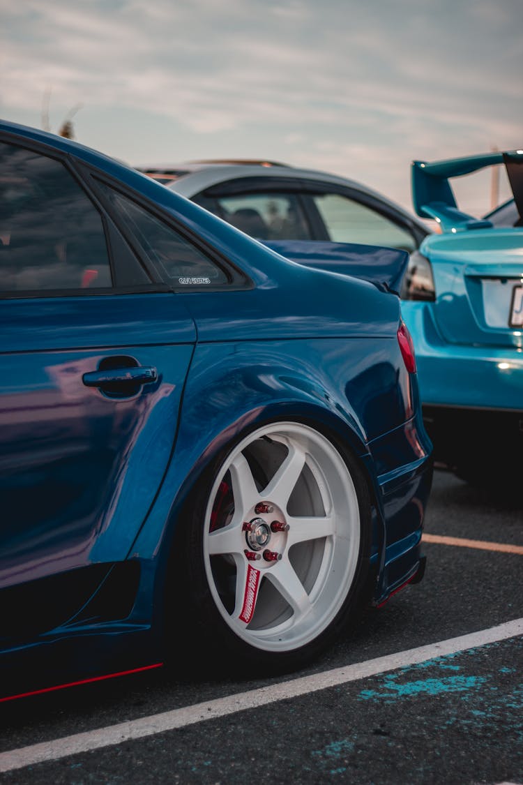 Shiny Blue Tuned Car Wheels Parked On Street