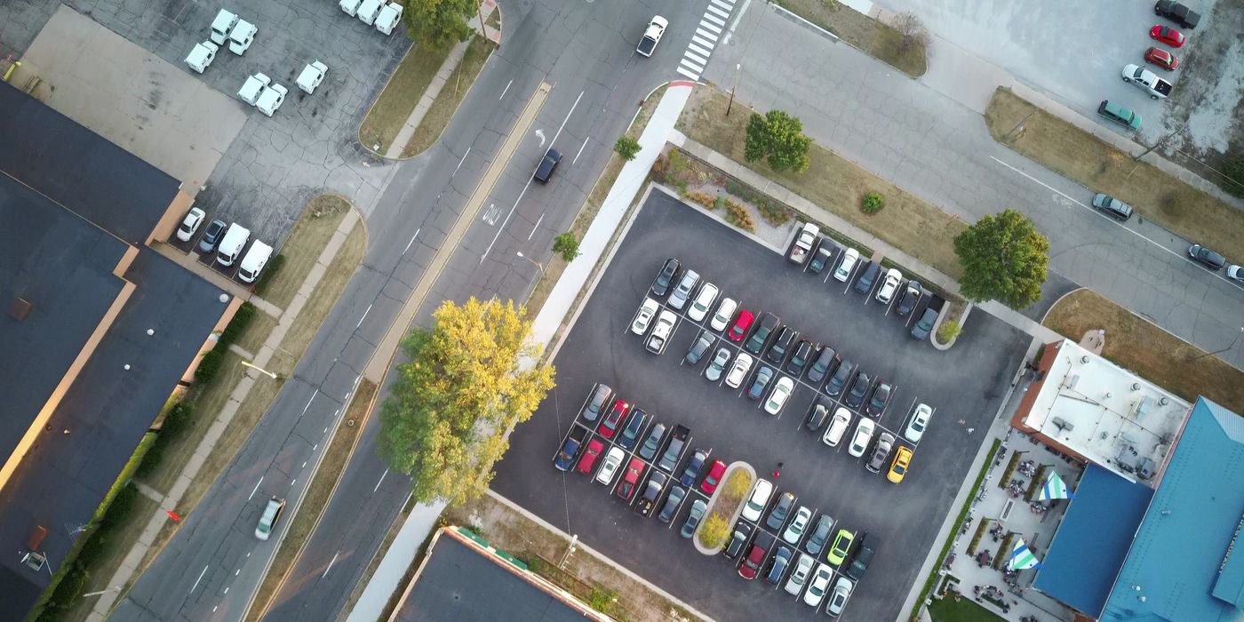 Rows of parked cars inside a multi level hotel parking garage