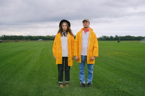 Free Couple of farmers in green field together Stock Photo