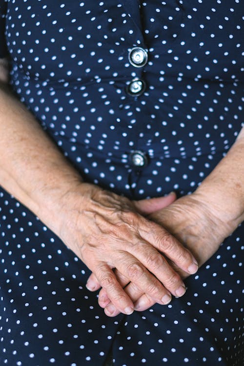 Free Crop senior woman with folded hands Stock Photo