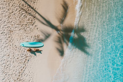 A Woman Relaxing on the Beach Shore