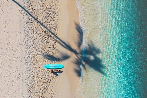 A Woman Sun Bathing in the Beach