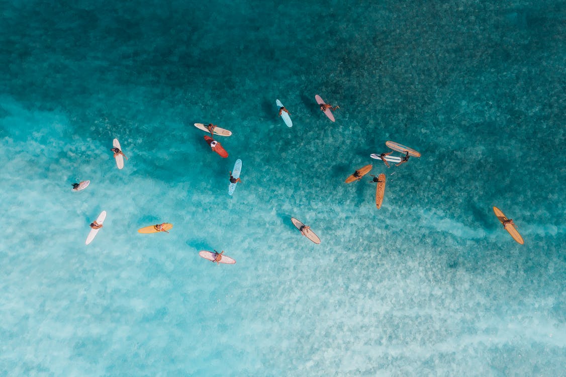 Free Aerial View of People Surfing on Sea Stock Photo