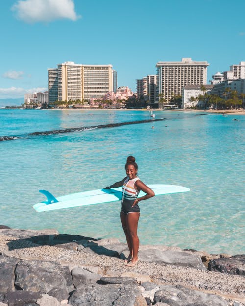 A Woman Holding Surfboard