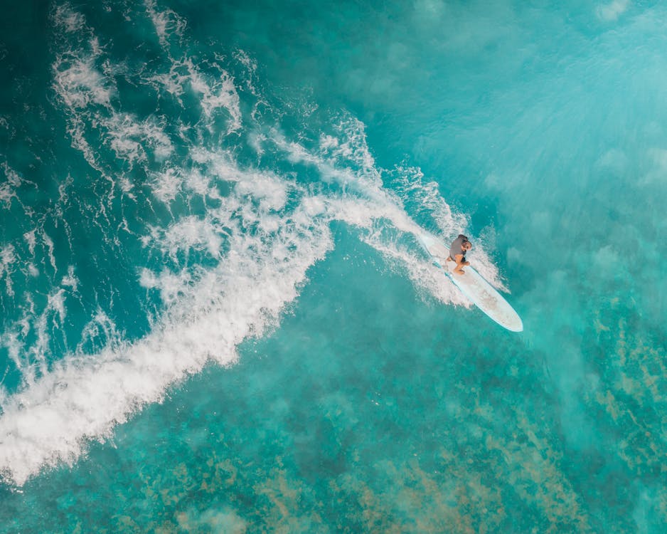 Person Surfing on a Sea Waves · Free Stock Photo
