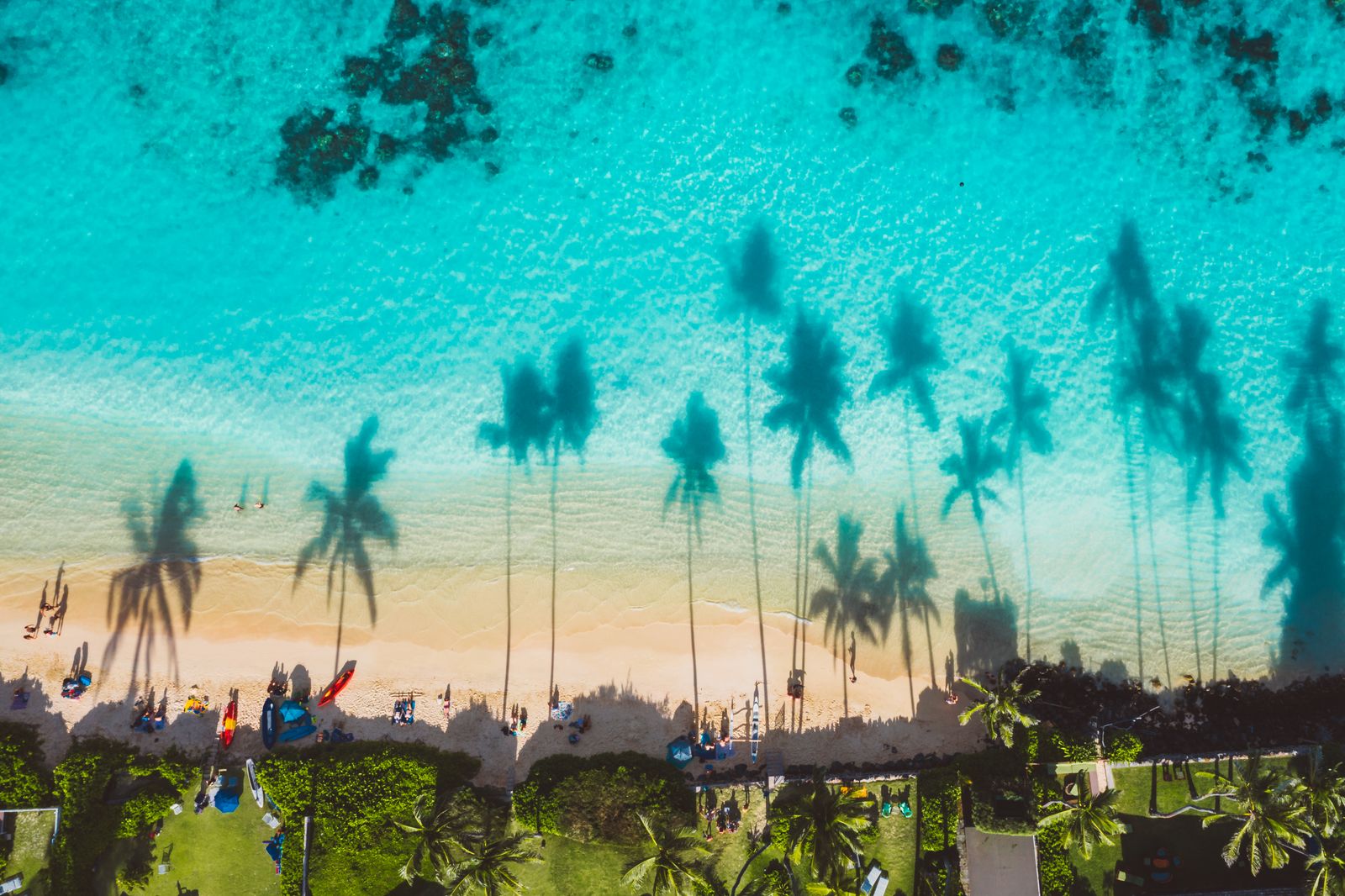 Hawaii beach aerial with turquoise water and golden sand