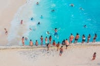 People Swimming in the Beach