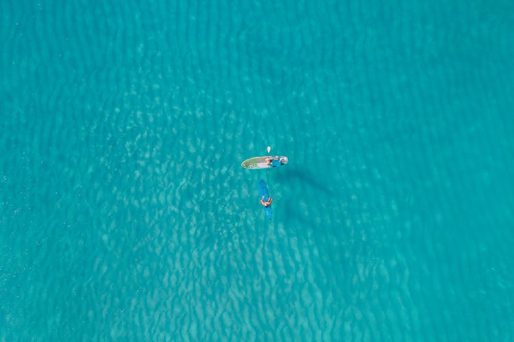 Surfboards On Calm Turquoise Sea Waters