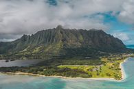 Green and Brown Mountain Under Cloudy Sky