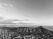 Grayscale Photo of Mountains and Clouds