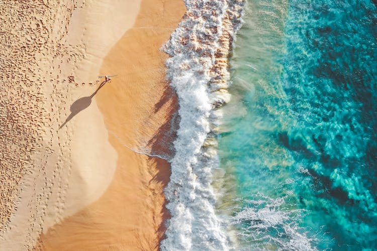 Sea Waves Breaking On Sandy Beach