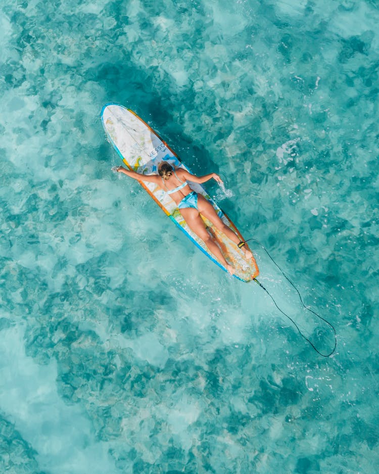 A Surfer Paddling