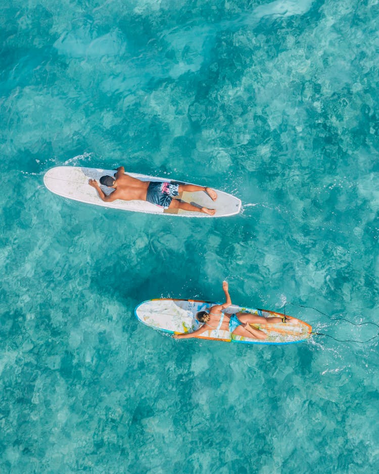 A Surfers Paddling