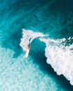 Person Surfing on Sea Waves