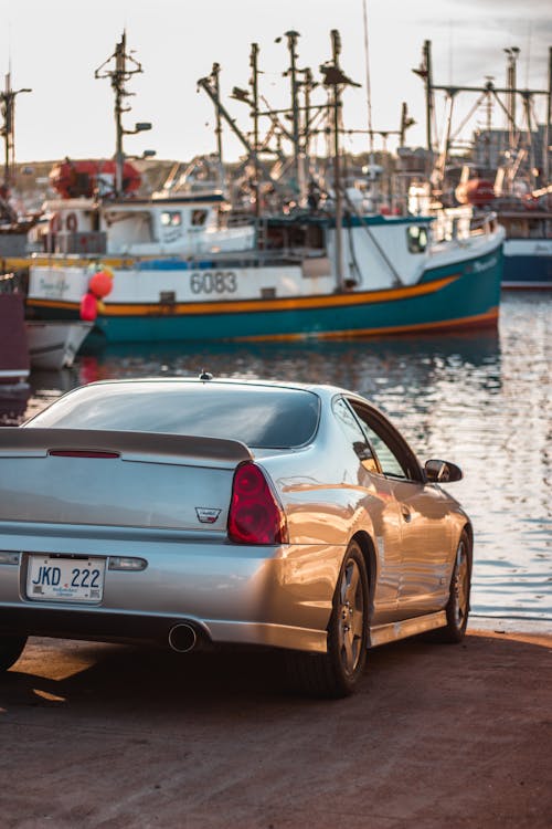 Tuned car on ground in harbor in daytime