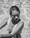 Woman in White Tank Top on Water