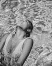 Woman in White Tank Top in Water