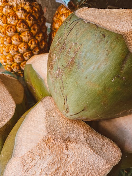 Foto profissional grátis de abacaxi, coco, cortar