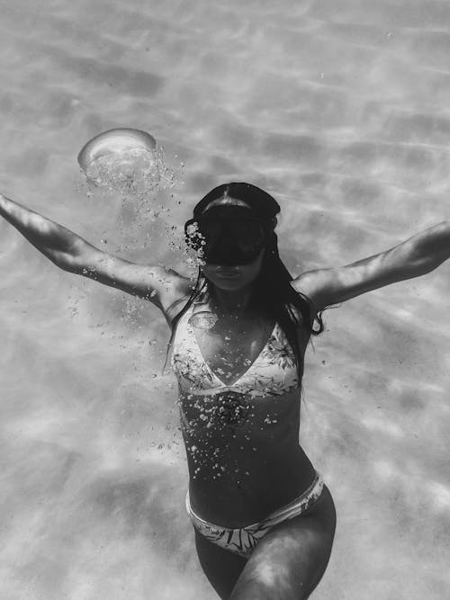 Woman in Bikini Swimming Underwater 