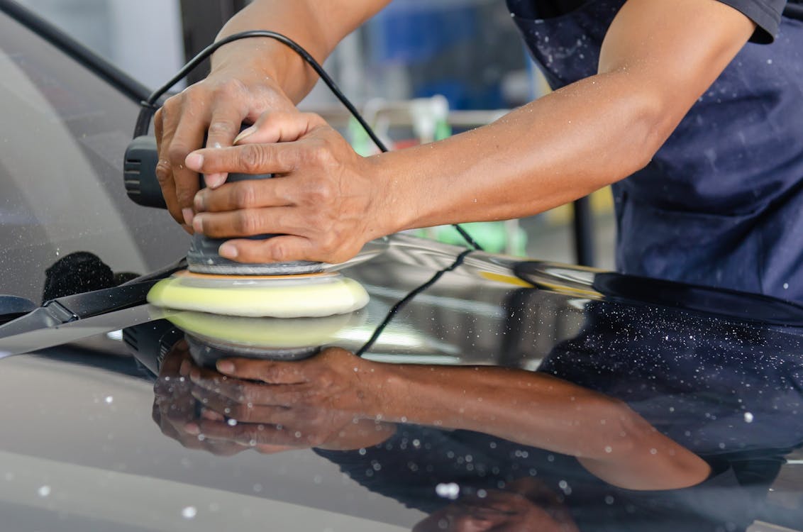 Free A Person Buffing a Car Stock Photo