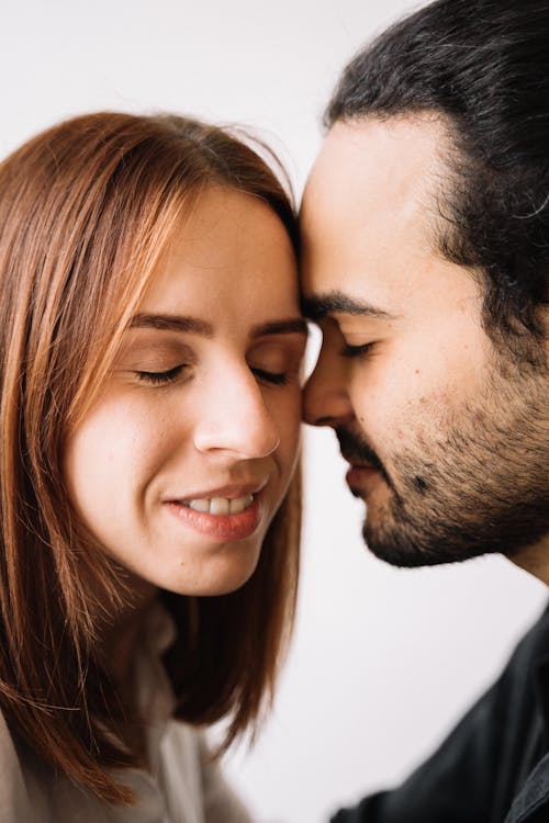 Man and Woman Kissing Each Other