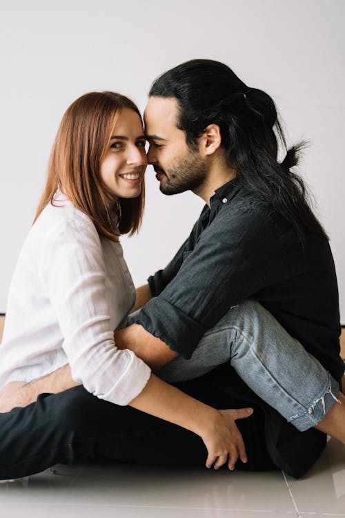 Couple Sitting Face to Face · Free Stock Photo