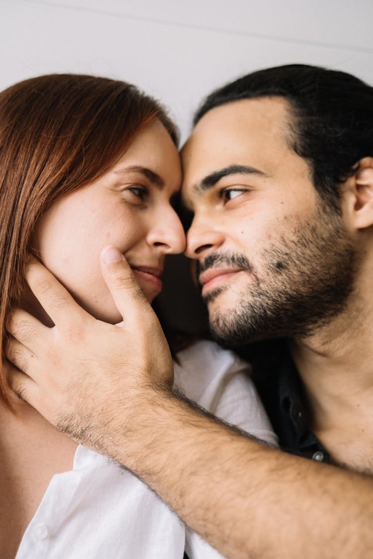 Man Caressing The Woman's Face