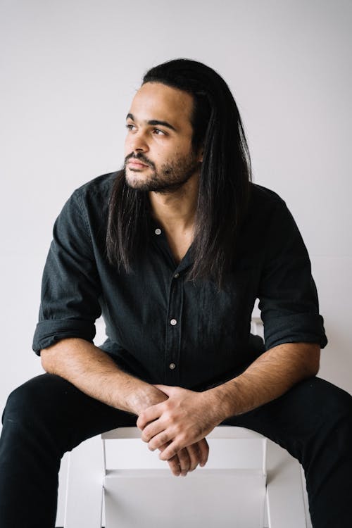 Long Haired Man in Black Button Up Shirt