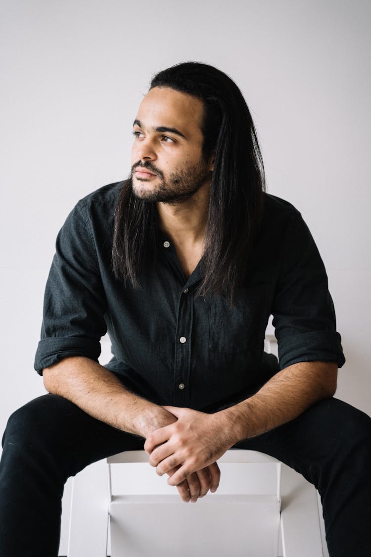 Long Haired Man In Black Button Up Shirt