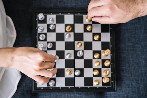 Flatlay Shot of People Playing Chess