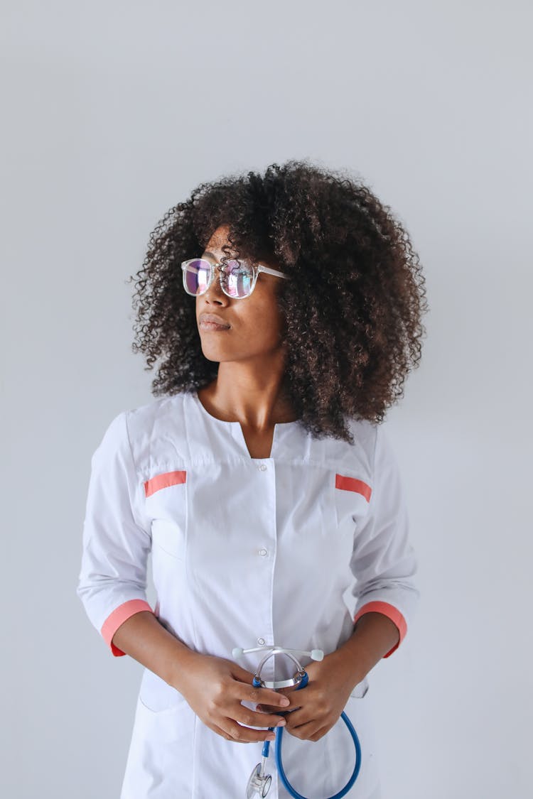 Woman In White Button Up Dress Wearing Sunglasses