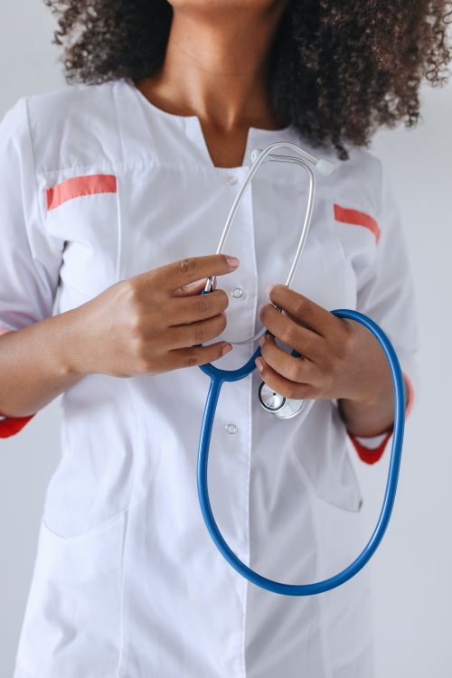 Free Close-up of a healthcare worker holding a stethoscope, highlighting medical professionalism. Stock Photo
