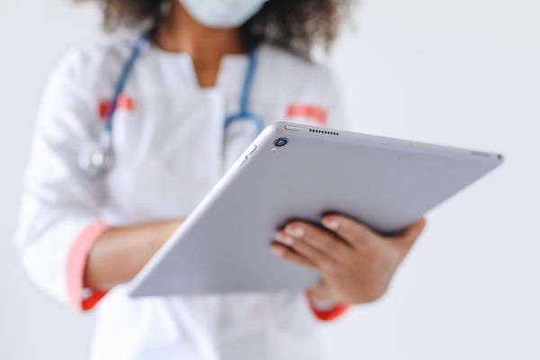 Home care professional assisting patient