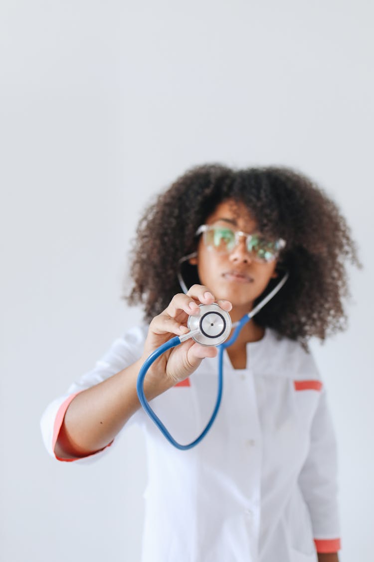 A Woman Holding A Stethoscope