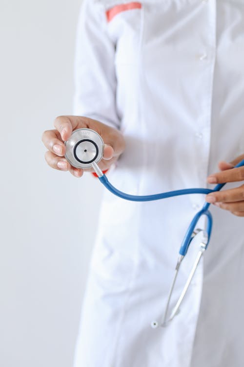 Free A Person Holding a Stethoscope Stock Photo