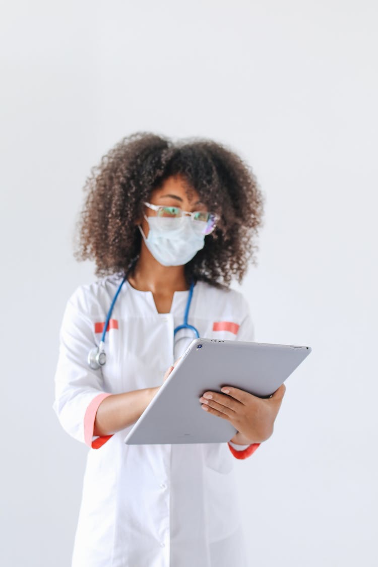 Female Doctor Using A Tablet 