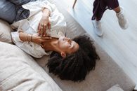 Woman Lying on Couch in Doctors Office