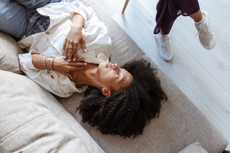 Woman Lying On Couch In Doctors Office