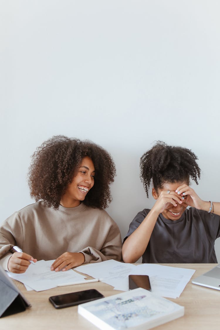 Teenage Girls Having Fun Studying Together