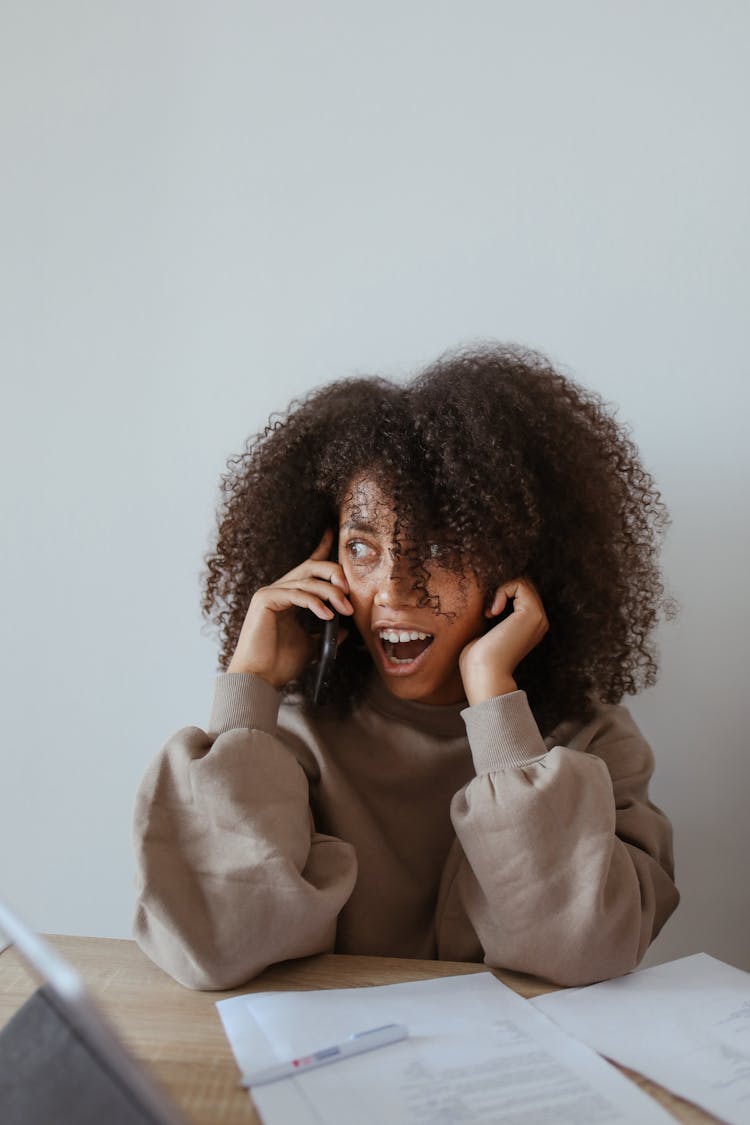 Shocked Face Of A Woman On A Phone Call