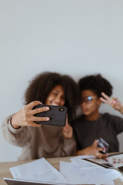 Free Women Posing Together and Taking a Selfie Stock Photo