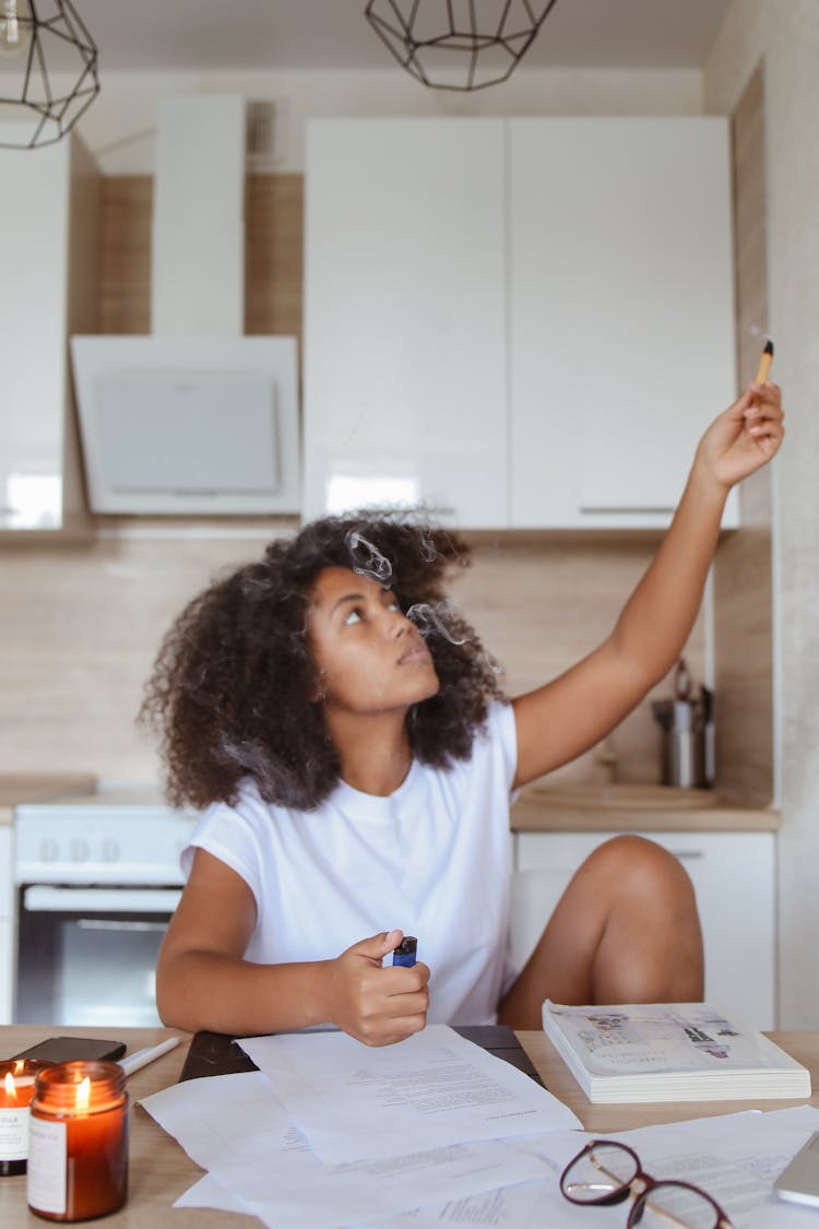 Woman Holding Scented Stick And Lighter