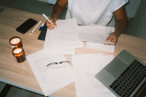 A Person Working on Documents