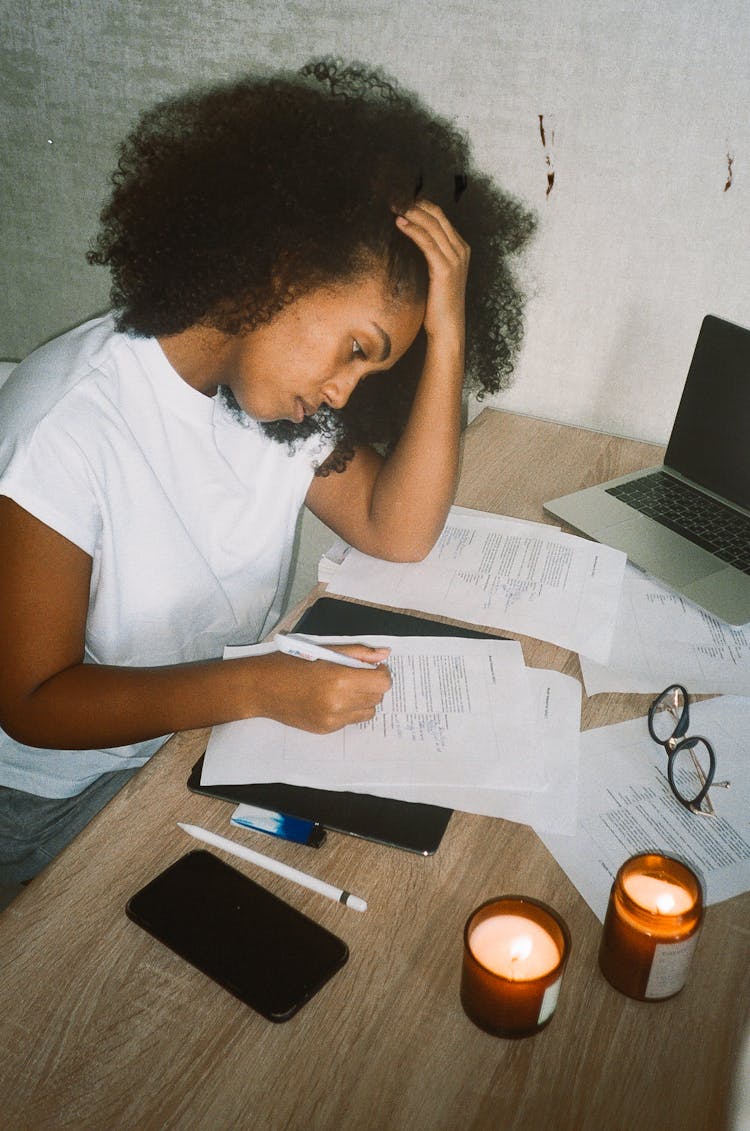 Tired Woman Working On Documents