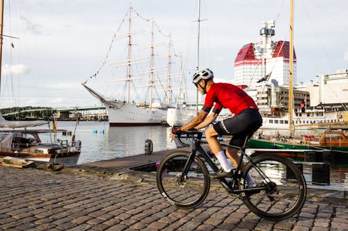A Cyclist Biking on Harbor