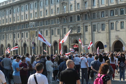 Free People with Flags on Demonstration near City Administration Building  Stock Photo