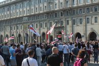 People with Flags on Demonstration near City Administration Building 