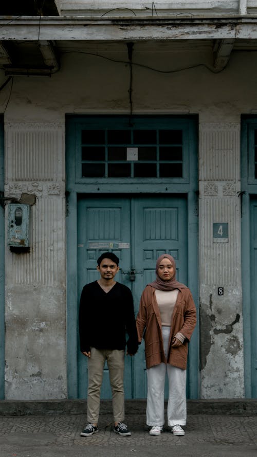 A Couple Standing by the Doorway